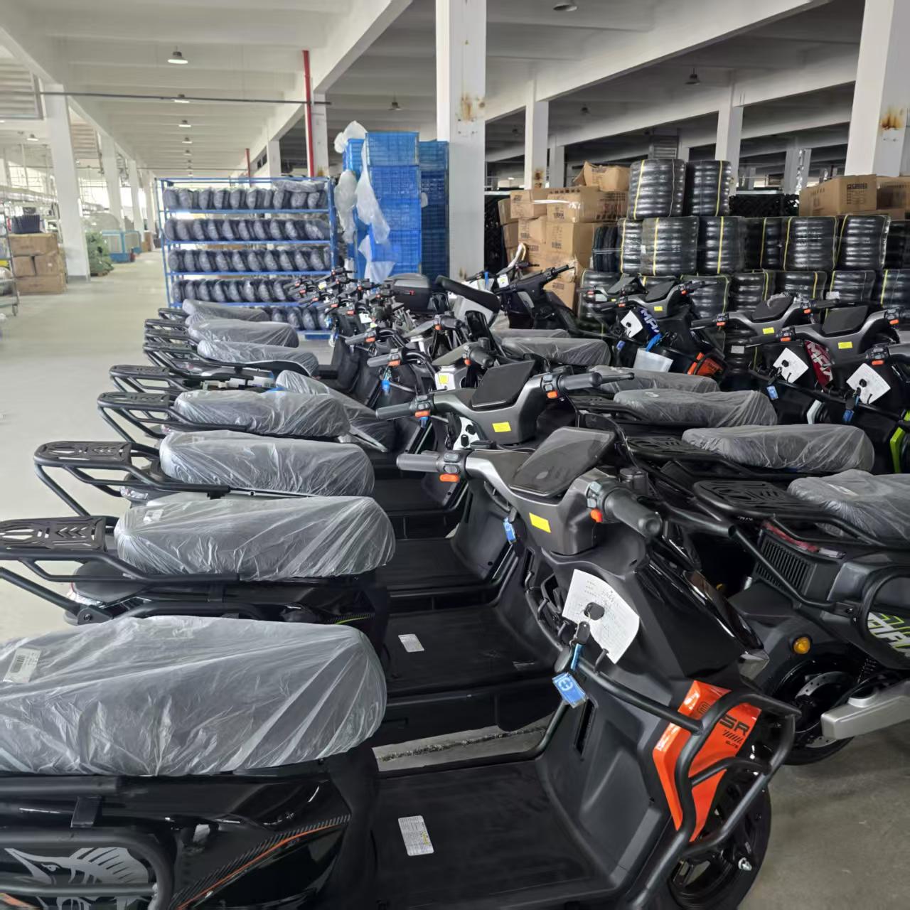 Completed vehicles staged inside a partner assembly facility